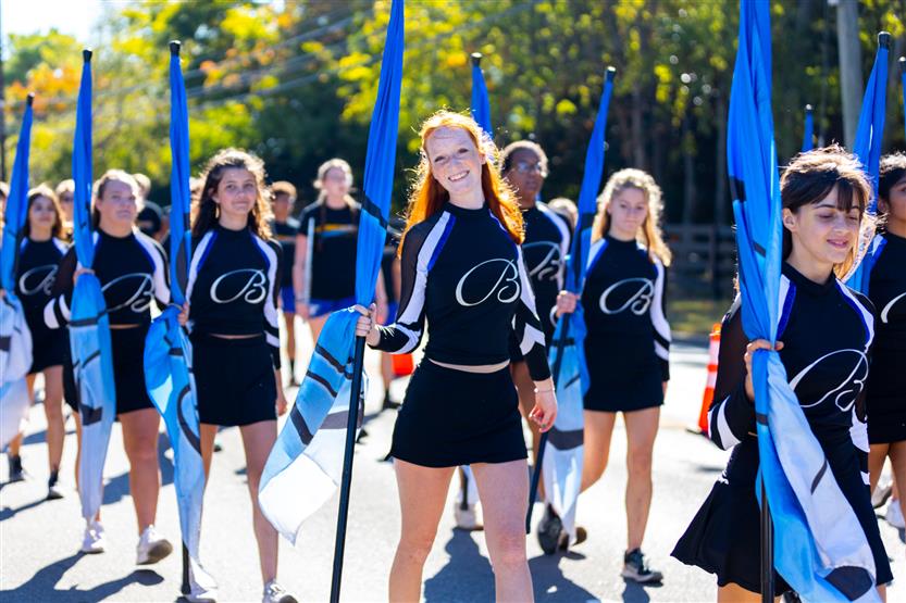 Brentwood High's color guard stands during the homecoming parade
